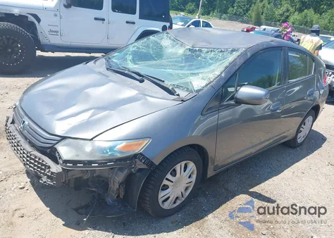 2011 Honda Insight from USA, damaged, VIN JHMZE2H37BS003597
